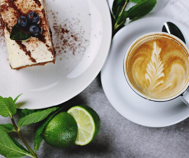 Coffee and a slice of chocolate cake.