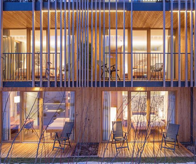 Steindl's Boutique Hotel in Vipiteno on a winter evening with illuminated façade and snow-covered surroundings.