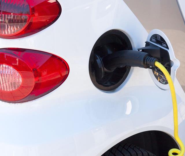 Close-up of an electric car charging.