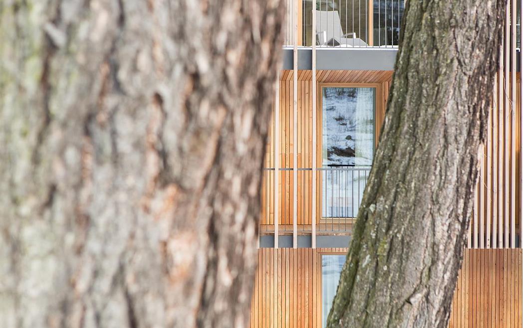 Balconies of Steindl's Boutique Hotel in Sterzing with modern wooden architecture.